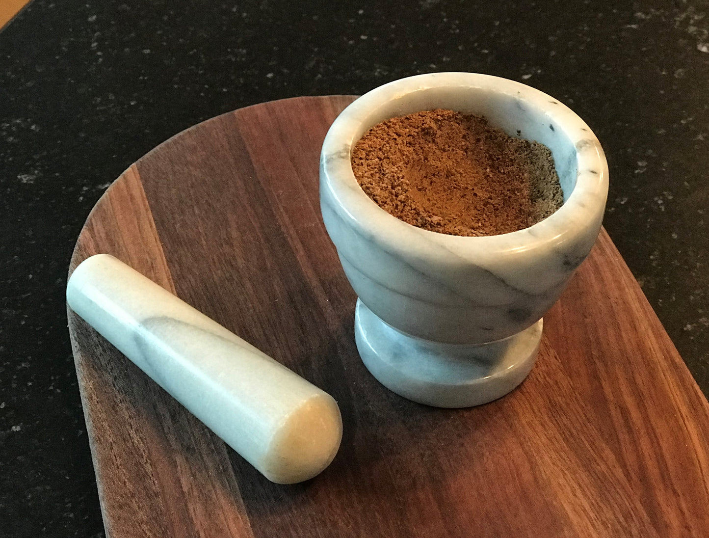 Yaupon Chai Powder spice blend in mortar and pestle